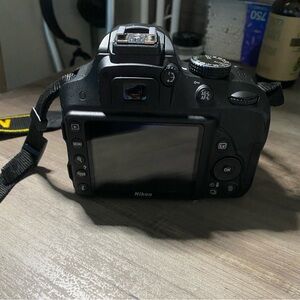 Nikon 3300D Camera with 55-200mm lens, 2 batteries, and 1 battery charger